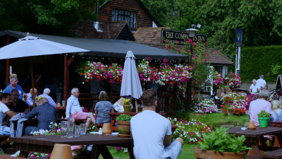 People enjoying drinks in a pub garden, ideal setting for a Husky outdoor back bar fridge in hospitality venues