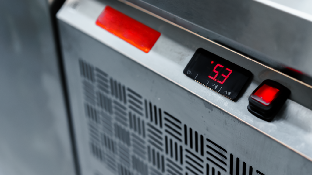 Close-up of a commercial fridge temperature control, emphasising the importance of cold chain management and how Husky intelligent fridges maintain food safety in last-mile delivery.