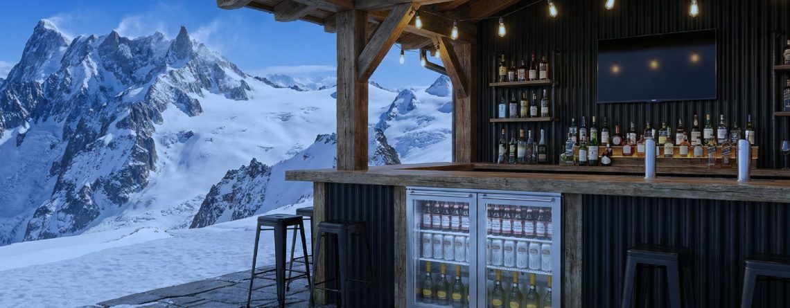 High quality refrigeration drinks fridge installed in an outdoor mountain bar, showcasing chilled beverages in a premium hospitality setting